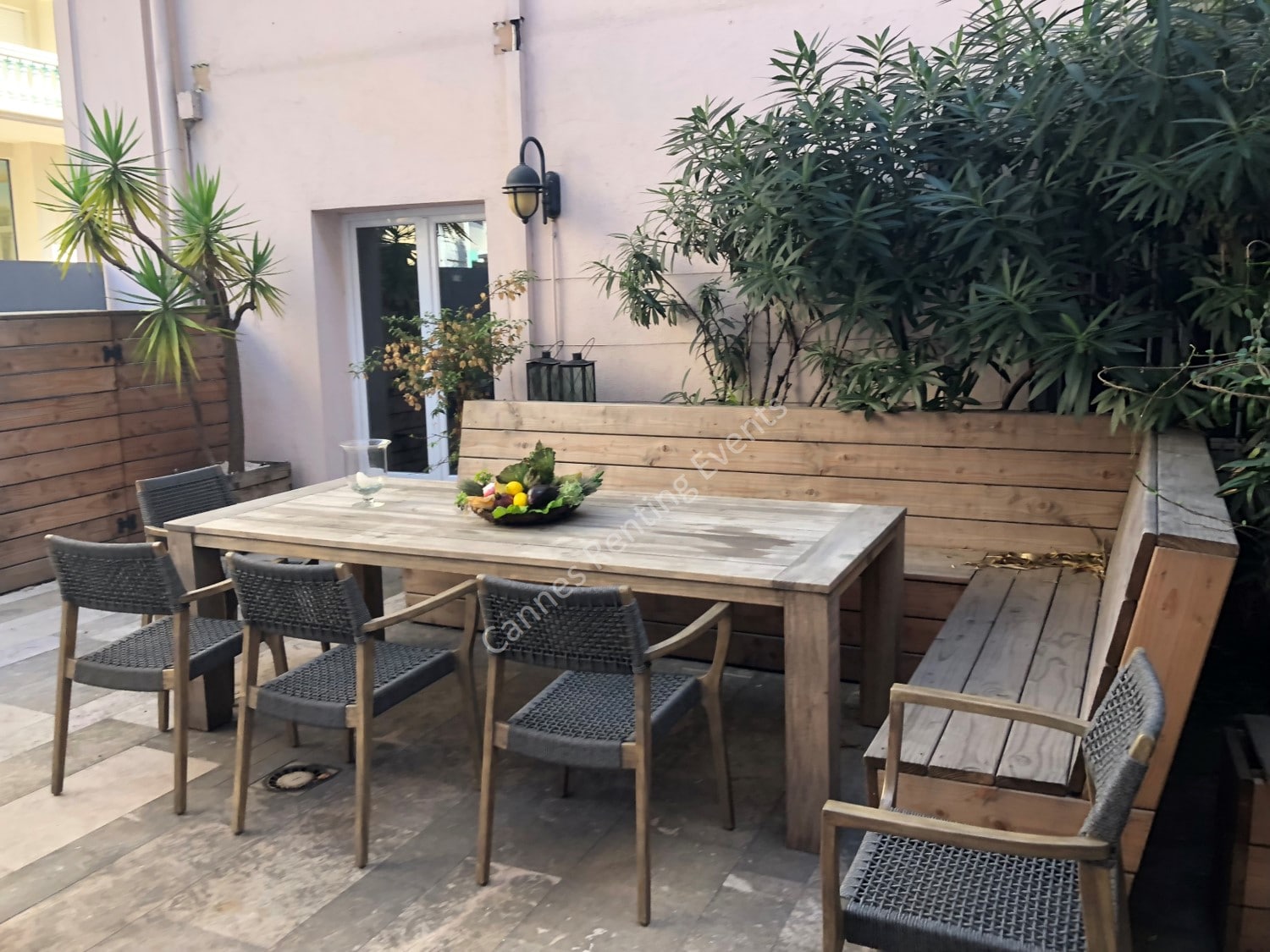 Private garden with large table.